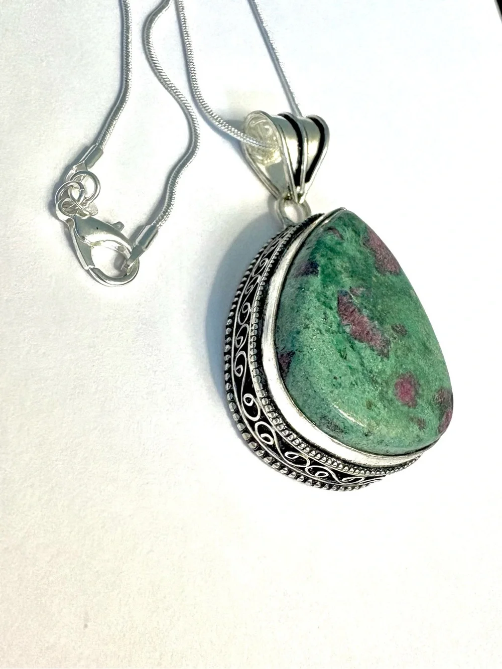 Beautiful, 2 inch, 925 marked, Ruby Zoisite pendant on a silver chain.